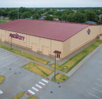 Aerial view showing back of building and parking lot