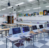 Classroom with long desks and computers
