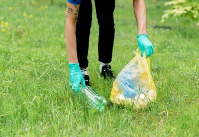 Photo of someone picking up trash