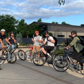 Photo of five PEC employees on bikes