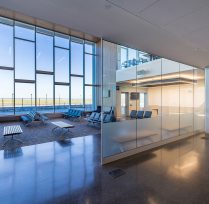 Interior view of waiting area with large window and seats