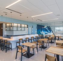 Interior view of airport restaurant with tables and chairs
