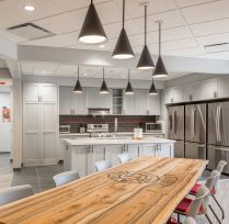 Interior showing kitchen with large wood table