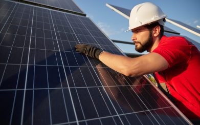 Bearded Engineer Touching Solar Panel