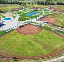 Aerial view of baseball field with waterpark in background
