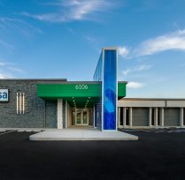 Exterior of building with green and blue roof