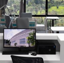 Close up of computer screen with patient room in background