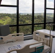 Patient bed with big windows in background