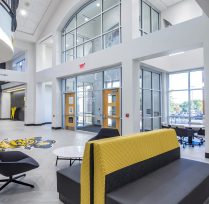 Front entrance with tall glass panels reaching the roof