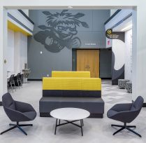 Couch with chairs in main hallway