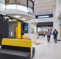 Front right of entrance with couches and hallway