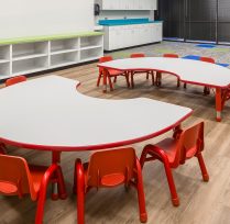 Child learning area with small red desk and chairs