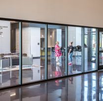 Hallway to classrooms with glass wall