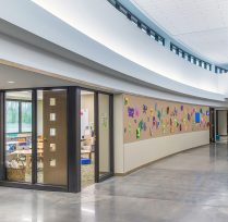 Curved hallway with colorful bulletin boards