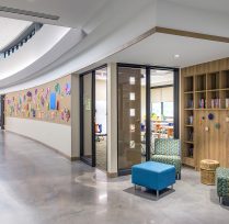Curved hallway with colorful bulletin boards