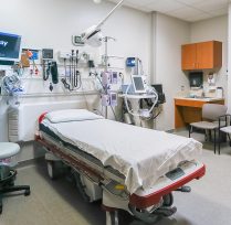 Hospital treatment room with bed and machines hooked up