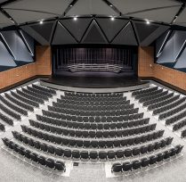 Wide view of auditorium and hundreds of seats