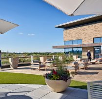 Patio area with tables, chairs, and planters