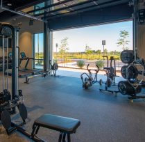 Gym area with garage door open