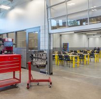 Classroom with garage door opened and tool kits