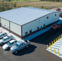 Aerial view of facility with steel roof