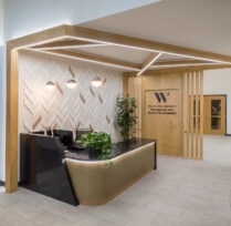 Side view of desk plants and sign