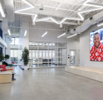 Learning Lab Large open lobby area with seating and screen