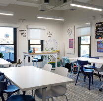 Classroom with three tables and chairs