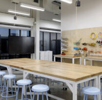 Large table and stools in art classroom