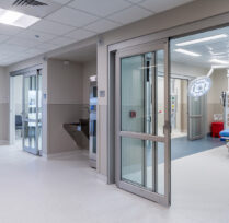 Operating room entrance with large glass doors